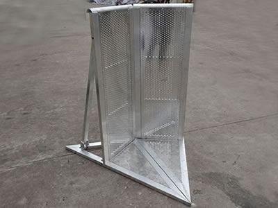 A corner type aluminum stage barrier on the concrete.