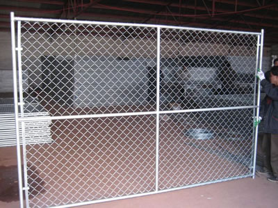 Many welded temporary fencing panels with round frame and square top lying on the floor neatly.