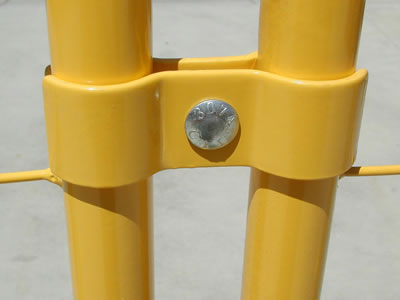 PVC coated temporary fence clamps connect the panels together. They are all painted with yellow.